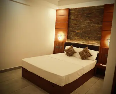 a bedroom with a large bed in a room at Silverstone Inn in Nedumbassery