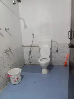 a bathroom with a toilet and a shower at Sandy Holiday Home 5 Bhk in Ooty