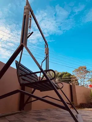 a swing on the side of a wall at MATHER RAJAGIRI FURNISHED APARTMENTS in Alwaye
