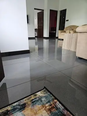 a living room with a rug on the floor at MATHER RAJAGIRI FURNISHED APARTMENTS in Alwaye