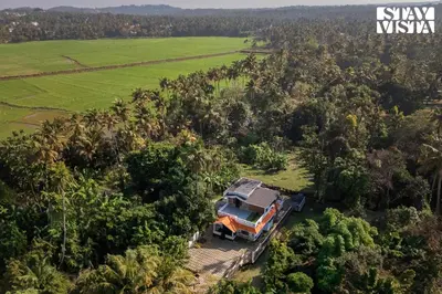 an aerial view of a house in the forest at StayVista at Nature Nook with Pvt Pool & Terrace Access in Trichūr
