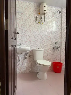 a bathroom with a toilet and a sink at VVP serviceapartments cochin Airport in Nedumbassery