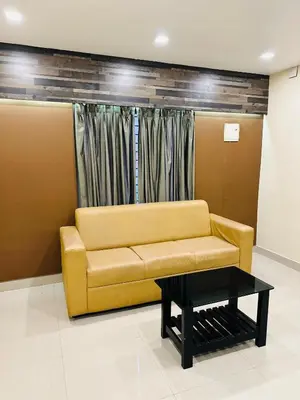 a living room with a couch and a coffee table at Kaira Regency in Olakara