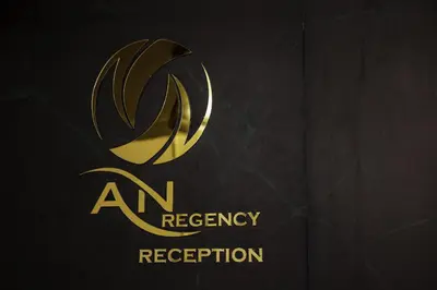 a gold logo for an agency reception at AN REGENCY in Edappāl