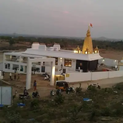 a building with a church with motorcycles in front of it at ARUL Residency in Mettuppālaiyam