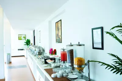 a room with a counter with a bunch of items on it at Hotel C7 Munnar in Munnar