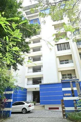 a car parked in front of a building at Geetham Villas in Palakkad