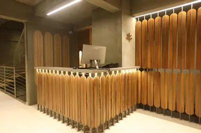 a row of wooden dividers in a room with a computer at BEL VISTO in Vālpārai