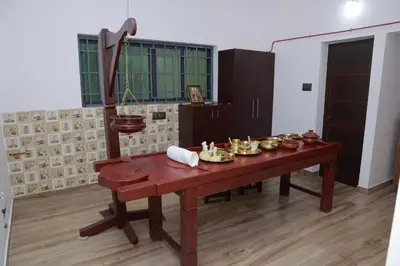 a room with a table with food on it at Nisarga Ayurveda in Kizhake Chālakudi