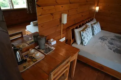 a small bedroom with a bed in a cabin at labdhi Resorts Masinagudi- Stag Groups not allowed in Masinagudi
