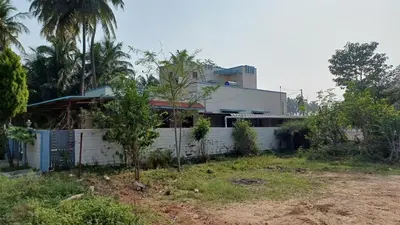 a house with a fence in front of it at SHI's Velliangiri 3BHK Individual villa Near Isha Adiyogi, Coimbatore in Alāndurai