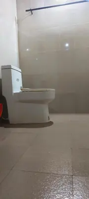 a bathroom with a toilet in a room at Angels Nest Home stay 2 Acra private plantation Mountain area balconey SunRice view Nearby Ngarhole wild life , Tholpetty wild life , Pakshipathalam Bird santuary , Kuruva island # Thirunelly & Thrissilery Temple Near by Secure Stay Wayanad Kerala in Chekadi