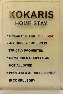 a sign that says kazaris home stay at Kokaris Coorg Homestay in Kushālnagar