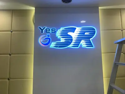 a sign for a yes sign on a wall at HOTEL SR in Palani