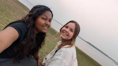 two women are standing next to each other at Arasu Homestay in Antarasante