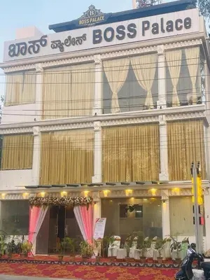 a building with a boss palace on the side of it at Hotel Boss Palace in Mysore