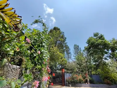 a fence with a bunch of flowers on it at Silver Spruce 2BHK Entire Floor Kotagiri in Kotagiri