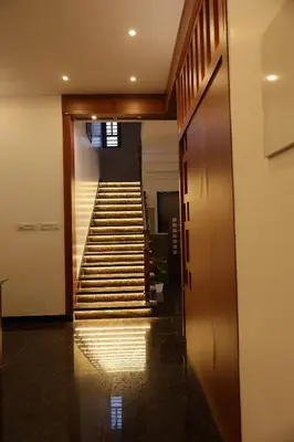 a hallway with stairs in a building at Le Serene in Meenangadi