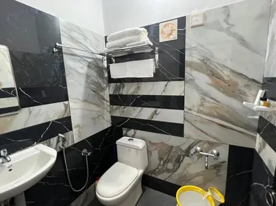 a bathroom with a toilet and a sink at Happy Villa Homestay - 4 in Chelakara