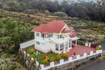 an overhead view of a house with a red roof at StayVista at Orion's Crest ooty including breakfast in Ooty