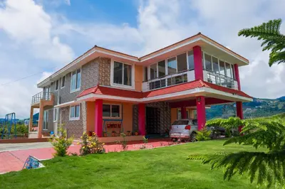 a house with a car parked in front of it at Green Premium Villa Ooty by Lexstays in Ooty