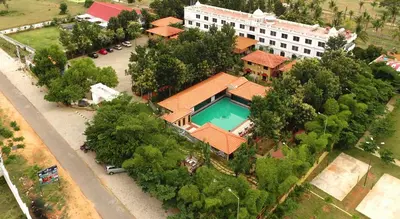 an overhead view of a house with a swimming pool at Jal Mahal Resort and Spa in Mysore