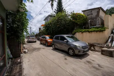 a group of cars parked on a city street at WINTEL WILD in Vālpārai