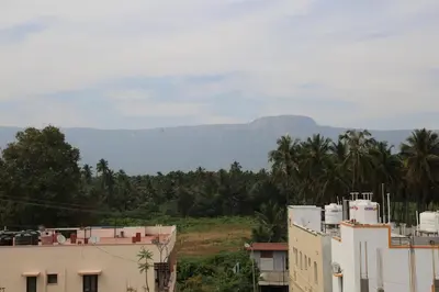 a group of buildings with mountains in the background at JP Residency, near to Isha, Adhiyogi & Karunya in Alāndurai