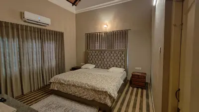 a small bedroom with a bed and a window at Diya's Estate Stay in Thamarassery