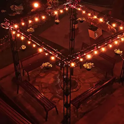 an overhead view of a room with lights and benches at Mannath Private Pool Villas at Vellarimala in Wayanad