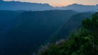 a view of a mountain range with trees and mountains at Mannath Private Pool Villas at Vellarimala in Wayanad