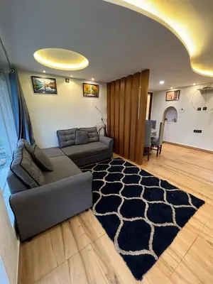 a living room with a couch and a rug at Not Open for Booking in Ooty