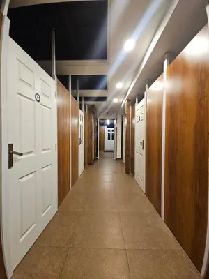 a hallway with a door at LOWFARE HOTELS in Kozhikode