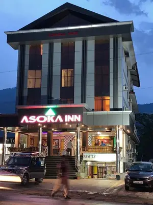 a building with a sota inc sign in front of it at Asoka Inn in Mettuppālaiyam