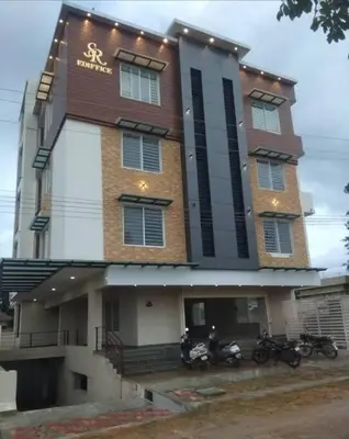 a building with motorcycles parked in front of it at 2BHK Flat by SR Renton Comfort Homestay Mysore @ Vijayanagar 2nd stage Mysore in Mysore