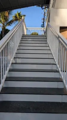 a set of stairs leading up to a building at Meghamalhar in Mānantoddy