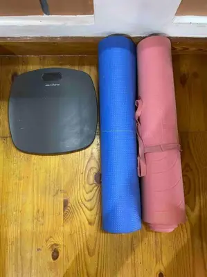 two rolls of thread and a computer mouse on a wooden floor at 'Vrindavan' in Heritage City Mysuru in Mysore