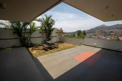 a view from the balcony of a house with a view at Asta in Ooty