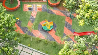 an overhead view of a garden with a table and chairs at M!steria Inn in Wayanad