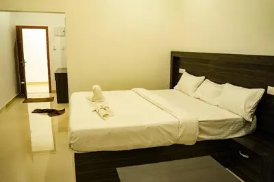 a bedroom with a bed with a towel on it at Karickanattu Nature Resort in Idukki