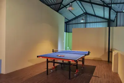 a ping pong table in a room at Avadale Kodaikanal - Stag Groups Not Allowed in Kodaikānāl