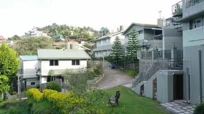 a view of a city with buildings and a street at Avadale Kodaikanal - Stag Groups Not Allowed in Kodaikānāl