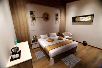 a bedroom with a large bed in a room at Cataleya in Kotagiri