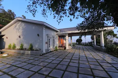 an image of a house with a driveway at Cataleya in Kotagiri