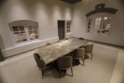 a dining room with a table and chairs at Cataleya in Kotagiri