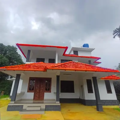 a small house with a red roof at Wayanad Empire Budget Villa in Kalpetta