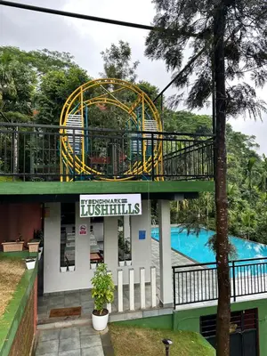 a resort with a roller coaster and a pool at Lush Hills by Benchmark in Kalpetta