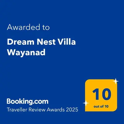 a yellow sign with the wordsdream nest villa wayward at Dream Nest Villa Wayanad in Kalpetta