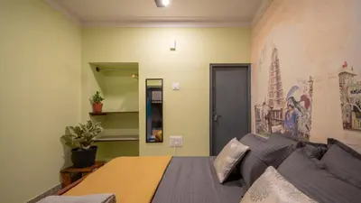 a living room with a couch and a table at Trippr Mysuru in Mysore