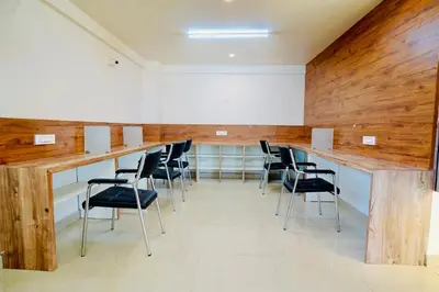 a conference room with a long table and chairs at Elite Enclave - Mysore - 2BHK Luxury Serviced Apartments in Mysore